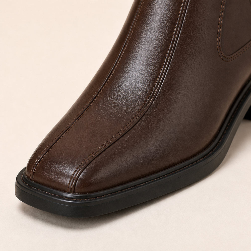 Black round-toe Chelsea boots with cushioned insole