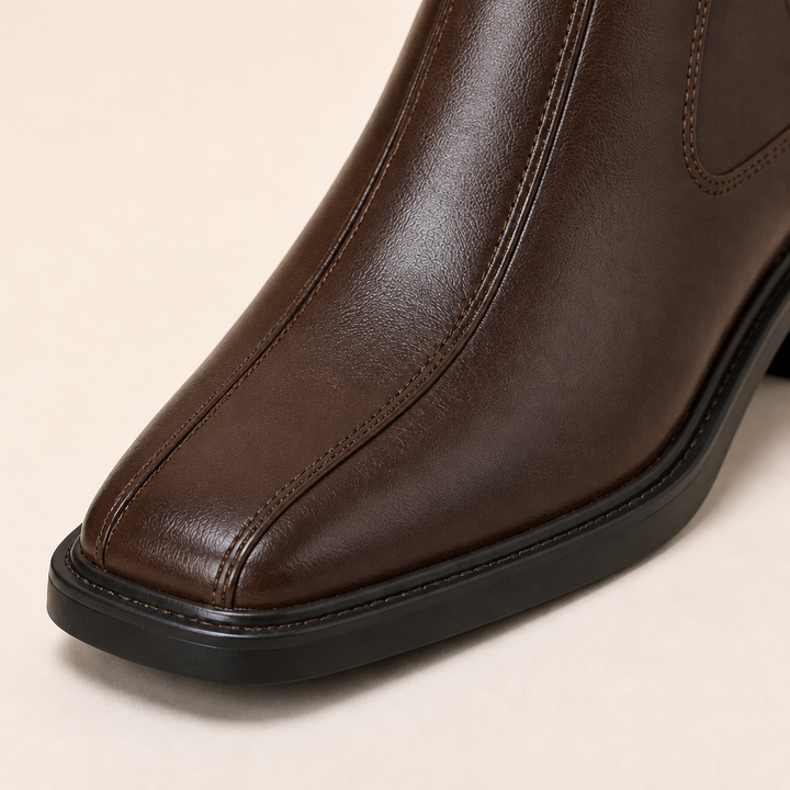 Black round-toe Chelsea boots with cushioned insole
